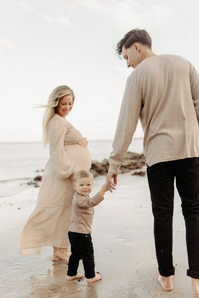 Jacksonville-Family-Photographer- pregnant mom with baby and dad at the beach