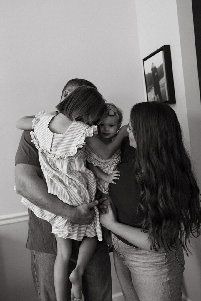 family of four standing together in their jacksonville florida home