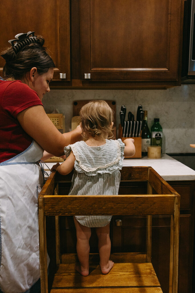 mom and daughter baking together.