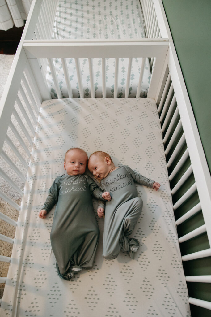 baby twins laying in their cribs