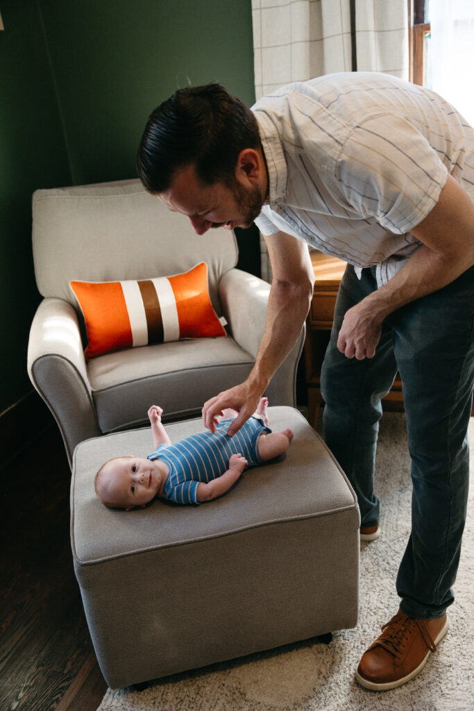 jacksonville fl dad spending time in the nursery with his baby son