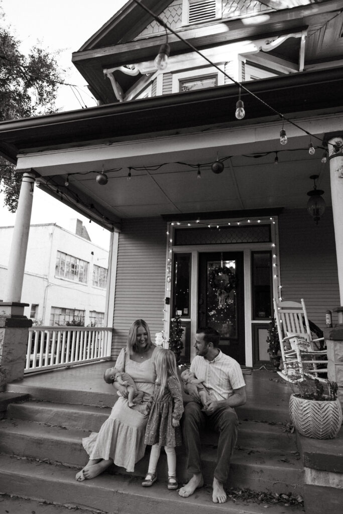 jacksonville fl family sitting on the porch laughing