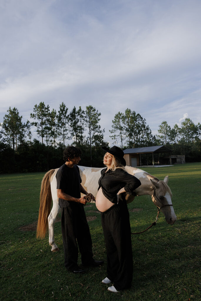 couple posing for a western style maternity photo session