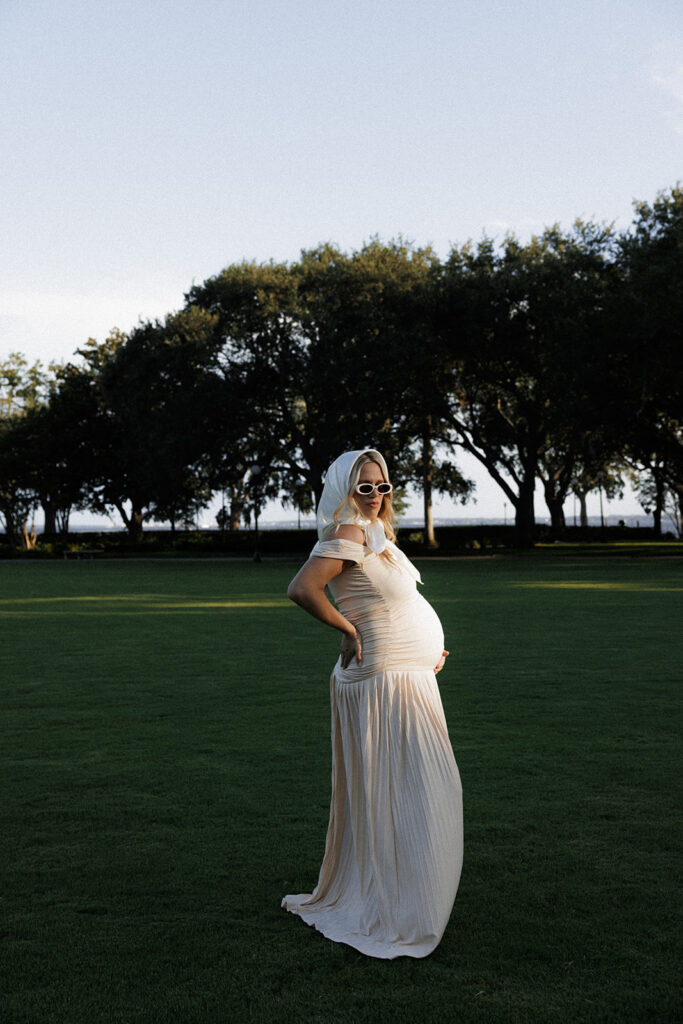 editorial maternity photography in jacksonville fl documenting a pregnant mother standing in the light